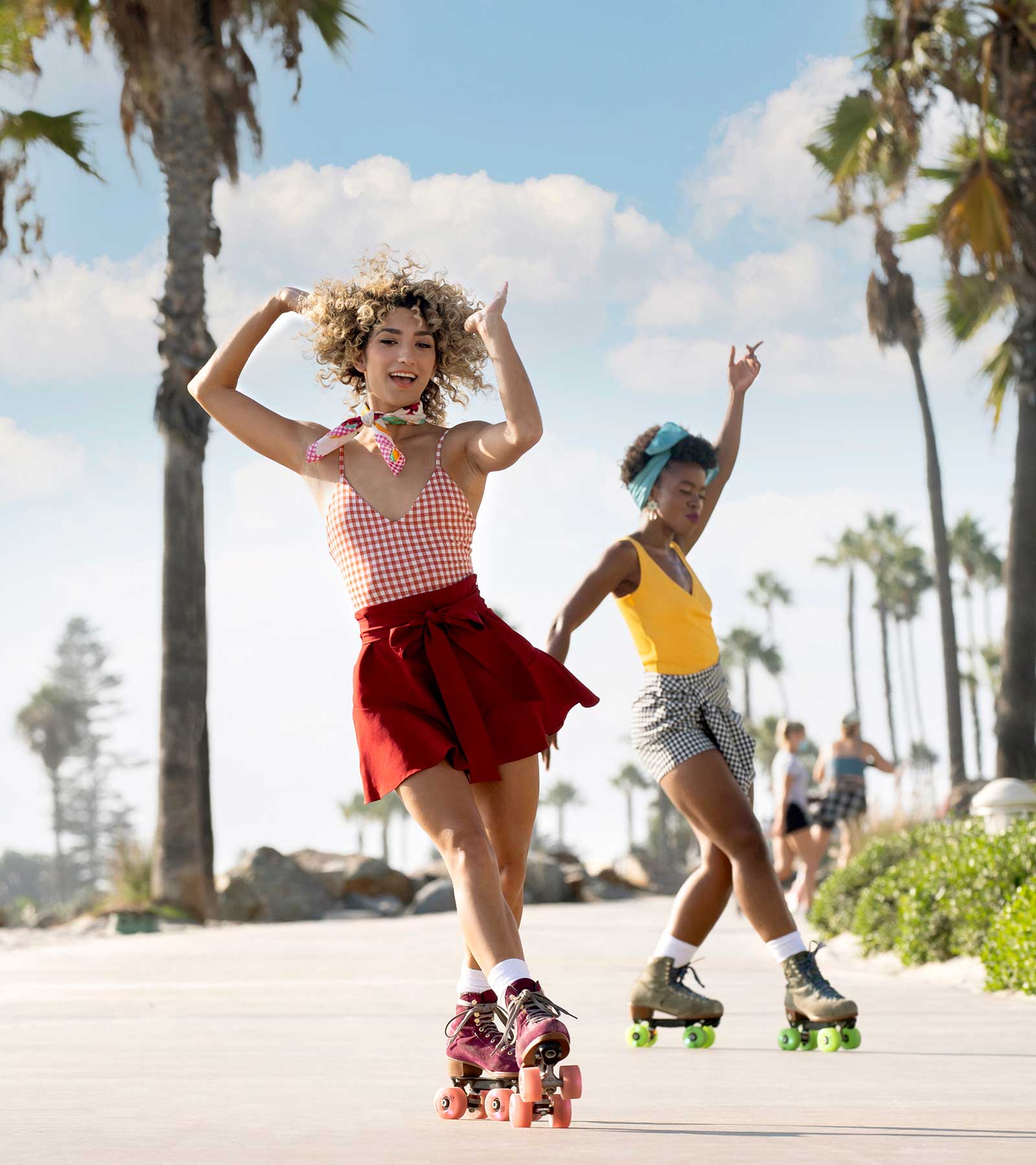 Women roller skating by the beach