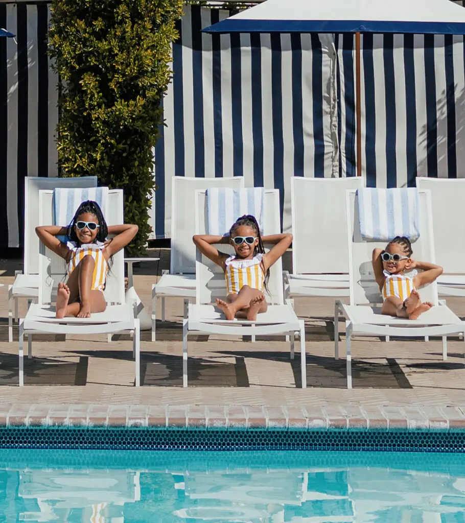 Three girls lounging at the Cabana Pool