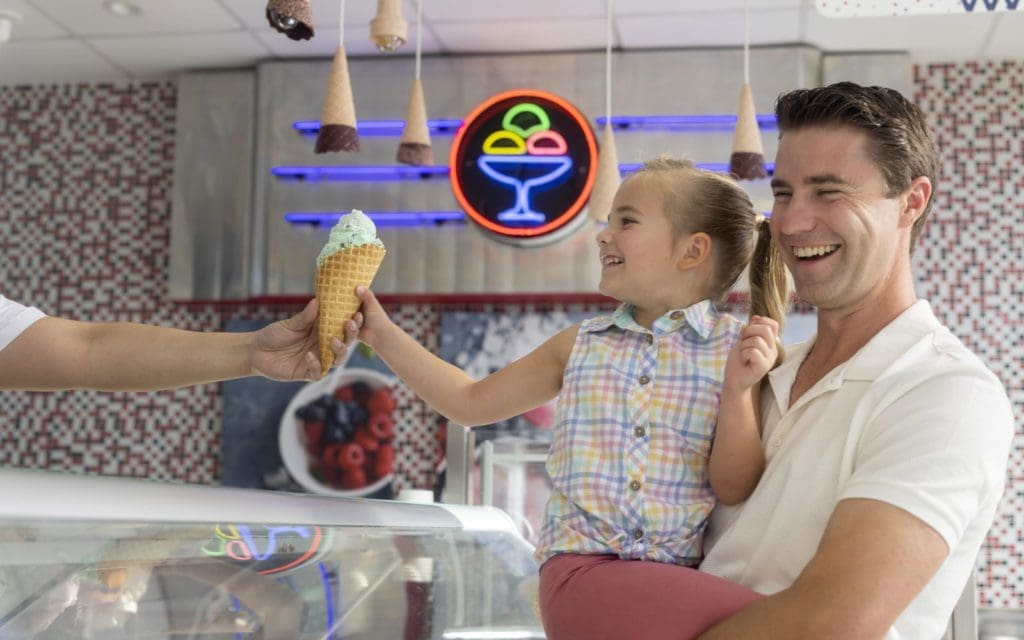 father and girl getting ice cream