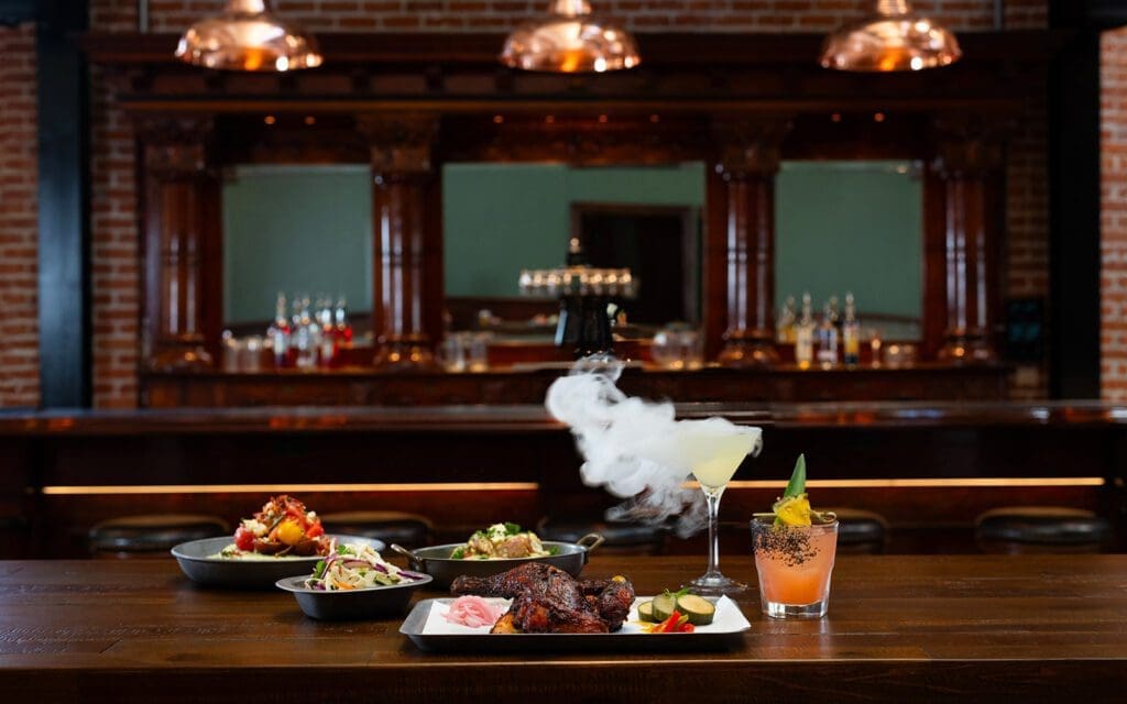 BBQ dishes by the bar with smoking cocktail