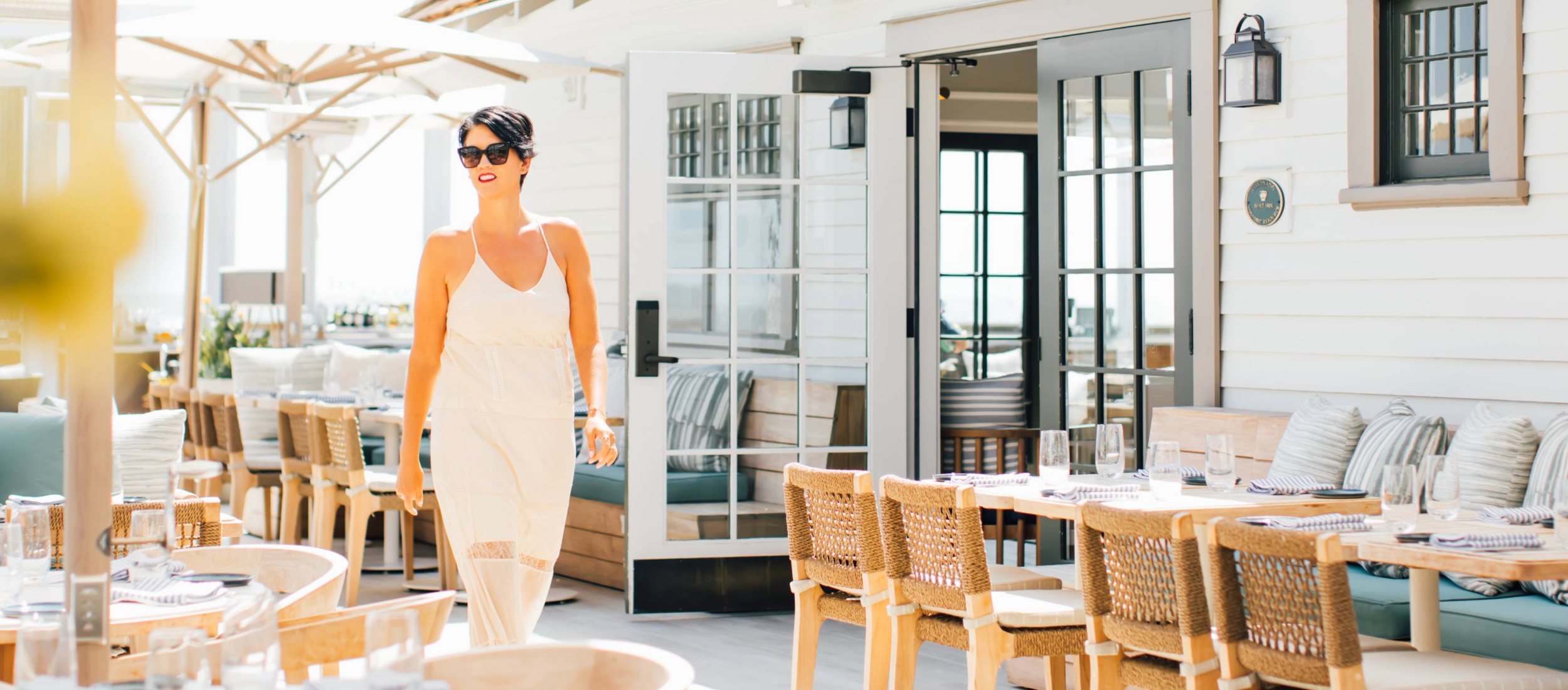 Woman walking on restaurant patio